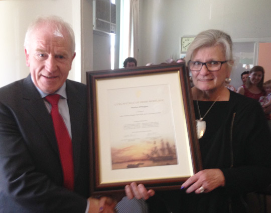 Minister Deenihan presents Mario O’Hagan, Administrator at the Irish Australian Resource and Support Bureau, Melbourne with a Certificate of Irish Heritage