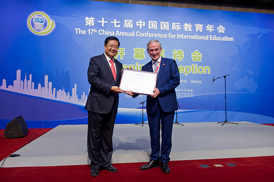 Minister Bruton receiving the Country of Honour Award from CEAIE President Dr. Liu Limin. Credit: Education in Ireland