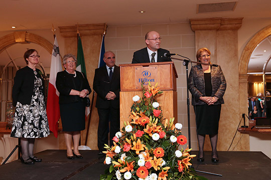 Ambassador Pádraig MacCoscair delivers a speech at an event celebrating St. Patrick's Day at the Hilton Malta Hotel.Also pictured from left to right: Ms.Ann Kieran (Ambassador’s wife) , Ms.Miriam Vella, Minister for Foreign Affairs Hon. Dr.George Vella, H.E Ambassador Mac Coscair and H.E The President of Malta Ms.Marie-Louise Coleiro Preca. 