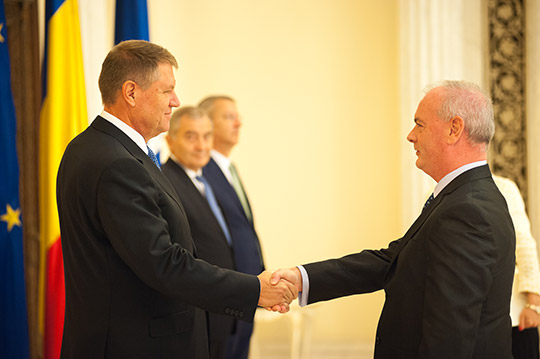 Ambassador Derek Feely shaking hands with President Iohannis, Bucharest. Credit: Presidential Administration