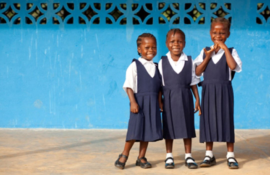 Schoolgirls from Grand Bassa, Liberia share a smile. Photo: Concern Worldwide